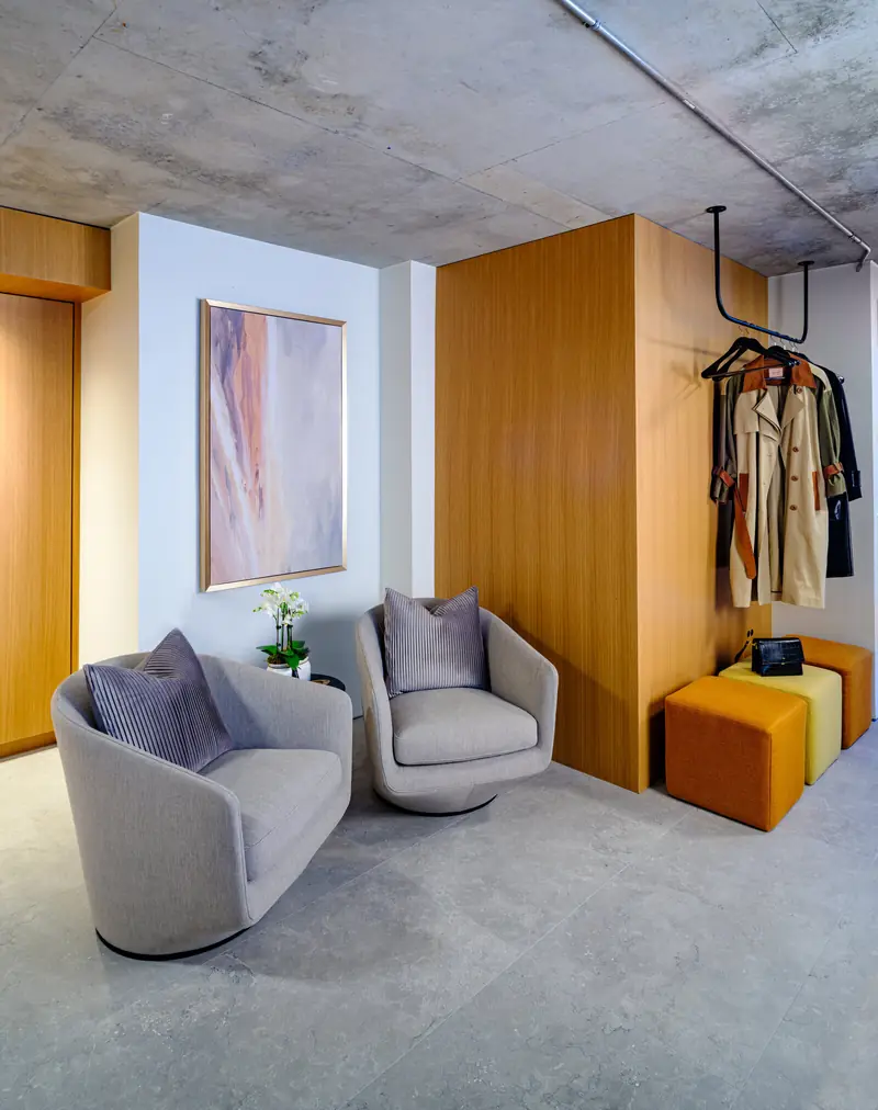 Lounge seating and oak millwork inside Studio 955
