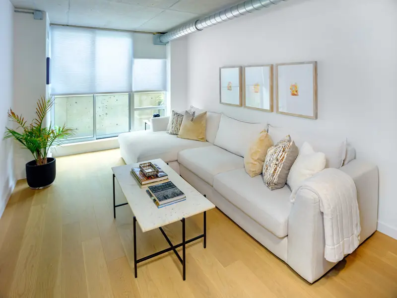 Bright lounge with white sofa at Studio 955