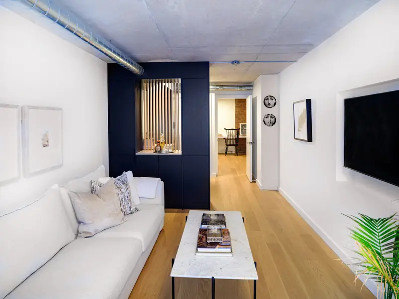 Lounge at Studio 955 with a navy accent wall